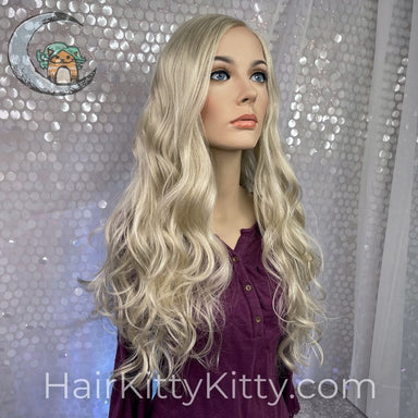Trinity Monofilament Wig - Harlow Blonde-Monofilament Left Part + Lace Front-Wigs Forever-Harlow Blonde Unrooted-Trinity | Harlow Blonde | 30 inches | Lace Front Wig | Mono Part-2022, 2A, All, Average, cool, Fringe: 18", Glam, Harlow Blonde Rooted, Heart + Inverted Triangle, Lace Front, Lace Part, Medical, Nape 18 - 22", No Permatease, Oblong + Rectangle, Oval + Diamond, Overall Length: 30", Round, Square, Synthetic (Non-HF), Triangle + Pear, Trinity, Wavy, Weight: 9 oz, WF, Wigs, zodiac-caprico