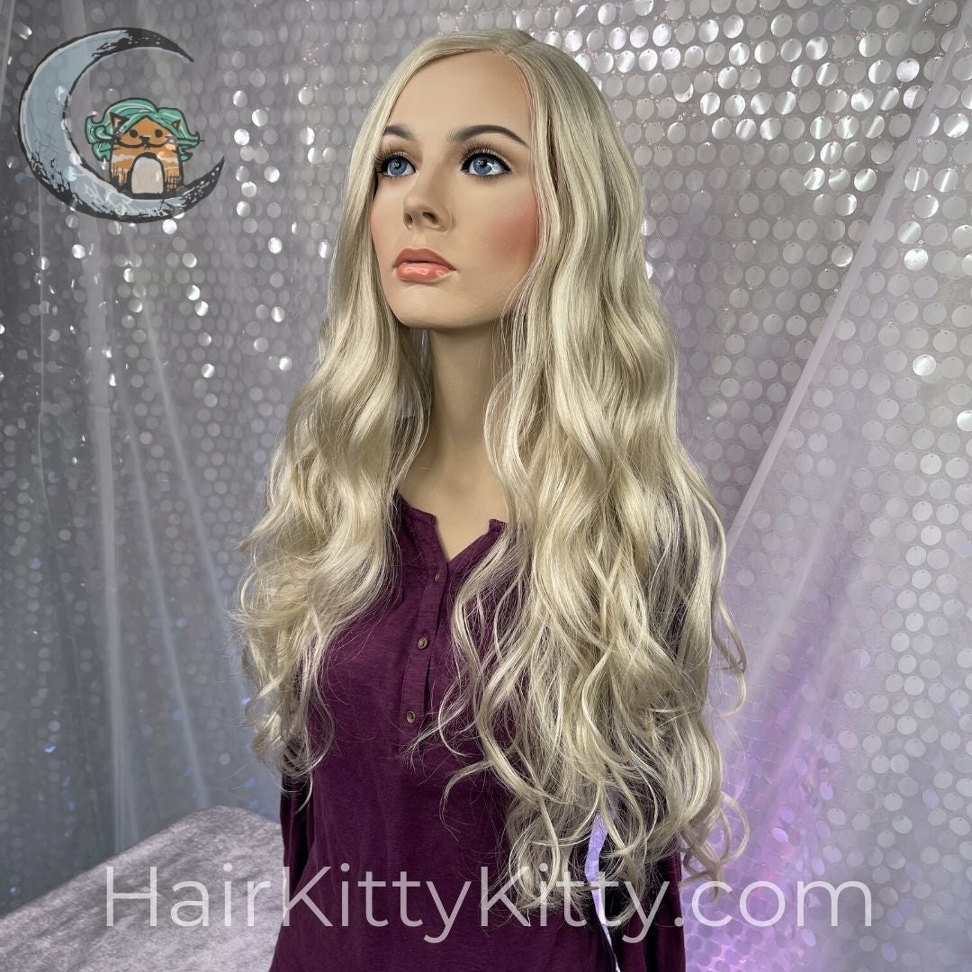 Trinity Monofilament Wig - Harlow Blonde-Monofilament Left Part + Lace Front-Wigs Forever-Harlow Blonde Unrooted-Trinity | Harlow Blonde | 30 inches | Lace Front Wig | Mono Part-2022, 2A, All, Average, cool, Fringe: 18", Glam, Harlow Blonde Rooted, Heart + Inverted Triangle, Lace Front, Lace Part, Medical, Nape 18 - 22", New Releases, No Permatease, Oblong + Rectangle, Oval + Diamond, Overall Length: 30", Round, Square, Synthetic (Non-HF), Triangle + Pear, Trinity, Wavy, Weight: 9 oz, WF, Wigs, 